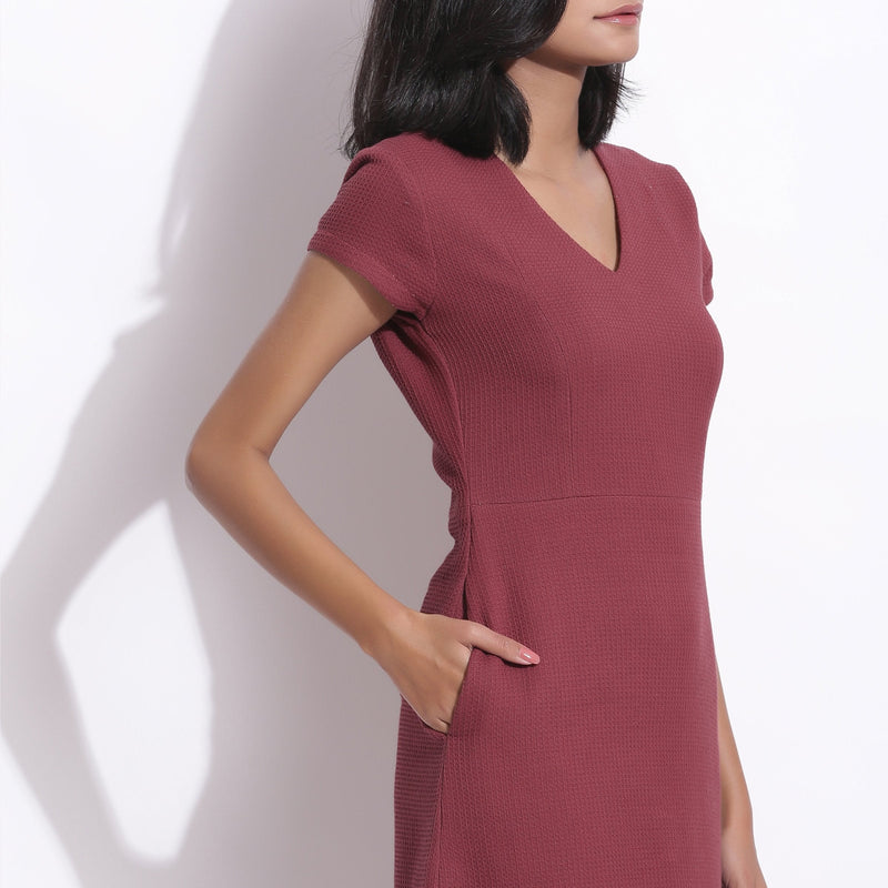 Front Detail of a Model wearing Barn Red Warm Cotton Waffle Knee Length Paneled Dress