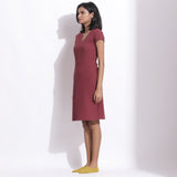 Left View of a Model wearing Barn Red Warm Cotton Waffle Knee Length Paneled Dress