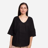 Front View of a Model wearing Black Loose Fit Drop Shoulder Top