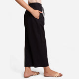 Right View of a Model wearing Black Cotton Flax Wide Legged Pant