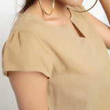 Front Detail of a Model wearing Beige Puff Sleeve Cotton A-Line Top