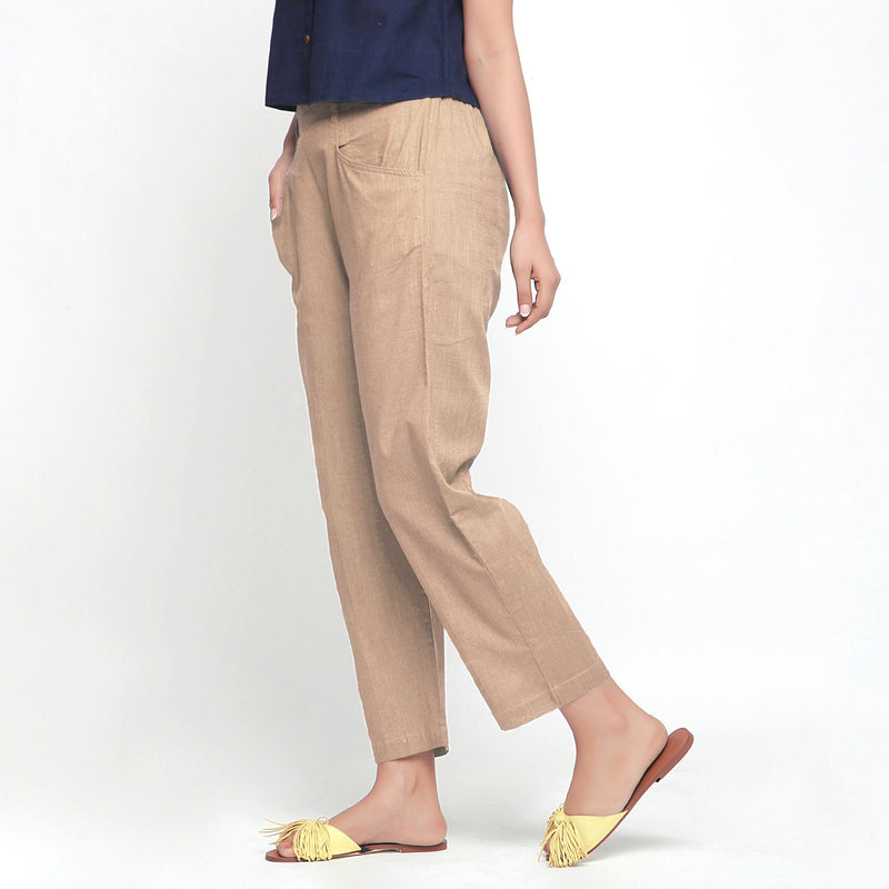 Left View of a Model wearing Beige Ankle Length Mid-Rise Chinos