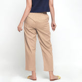 Back View of a Model wearing Beige Ankle Length Mid-Rise Chinos