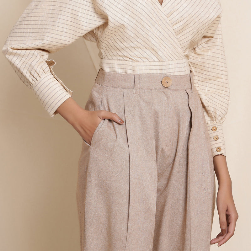 Front Detail of a Model Wearing Dusk Brown Box Pleated Pegged Pant