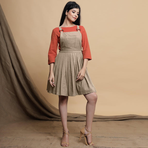 Front View of a Model wearing Beige Pleated Cotton Flax Knee Length Criss-Cross Back Dress