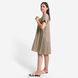 Left View of a Model wearing Beige Cotton Flax V-Neck Short Shift Tunic