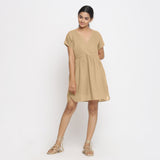 Front View of a Model wearing Beige Cotton Solid Wrap Dress