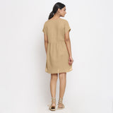 Back View of a Model wearing Beige Cotton Solid Wrap Dress