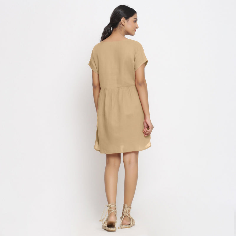 Back View of a Model wearing Beige Cotton Solid Wrap Dress