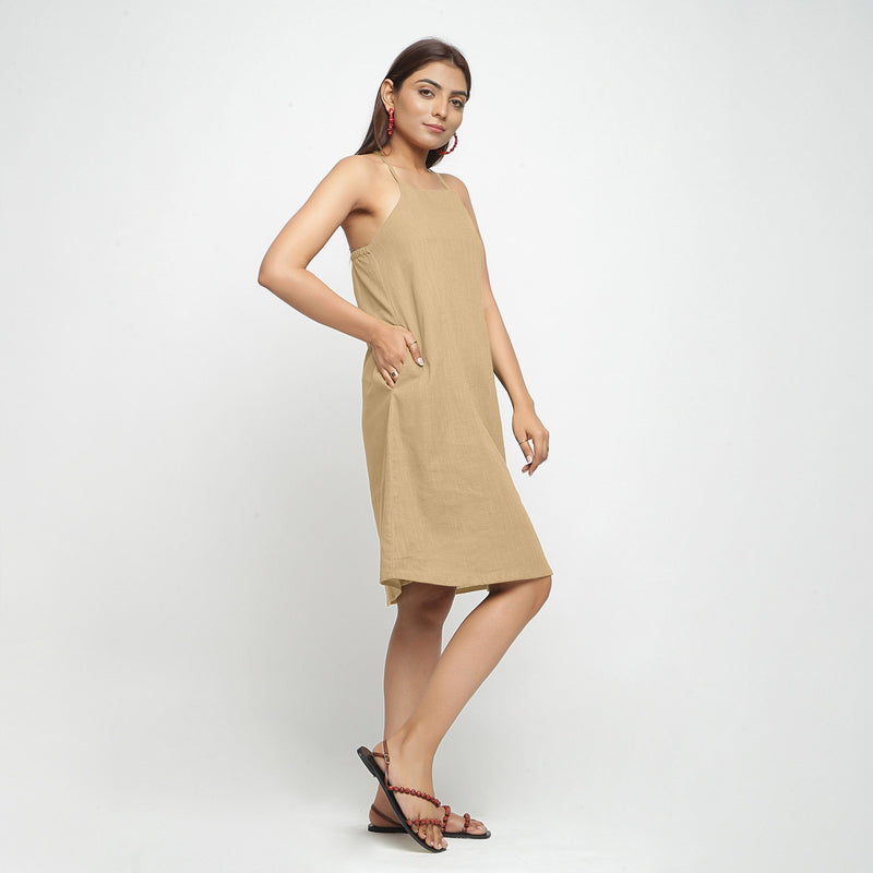 Right View of a Model wearing Beige Criss-Cross Cotton A-Line Dress