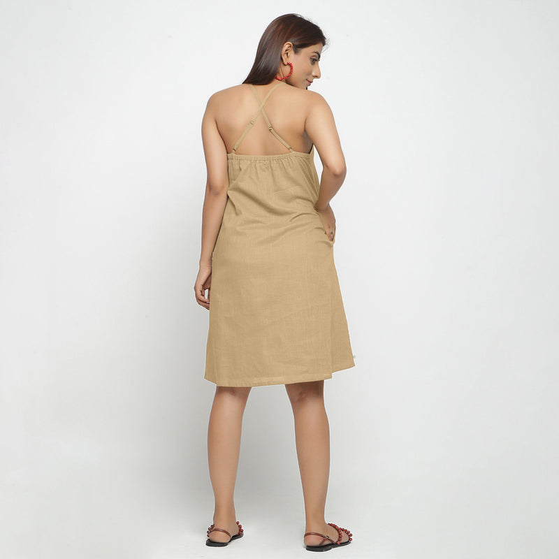 Back View of a Model wearing Beige Criss-Cross Cotton A-Line Dress