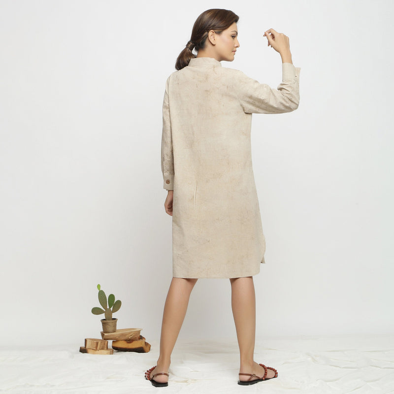 Back View of a Model wearing Beige Dabu Hand-Lep Cotton Knee Length Shirt Dress