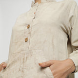 Front Detail of a Model wearing Beige Dabu Cotton Button-Down Dress