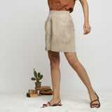 Left View of a Model wearing Beige Dabu Print Cotton Flared Shorts