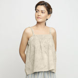Front View of a Model wearing Beige Dabu Print Strappy Camisole Top