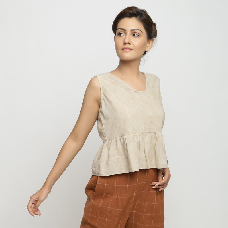 Right View of a Model wearing Beige Dabu Printed Sleeveless Gathered Top