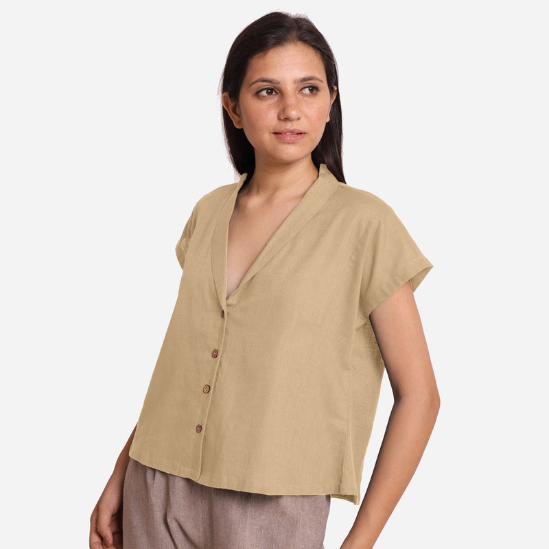 Left View of a Model wearing Beige Deep Neck Button-Down Cotton Top