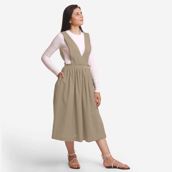 Right View of a Model wearing Beige Deep Neck Pinafore Midi Wrap Dress
