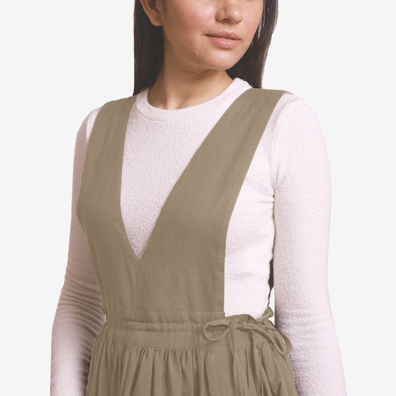 Front Detail of a Model wearing Beige Deep Neck Pinafore Midi Wrap Dress