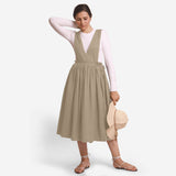 Front View of a Model wearing Beige Deep Neck Pinafore Midi Wrap Dress