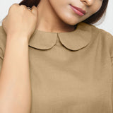 Front Detail of a Model wearing Beige Everyday Essential A-Line Top