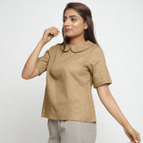 Left View of a Model wearing Beige Everyday Essential A-Line Top