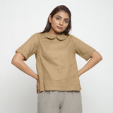 Front View of a Model wearing Beige Everyday Essential A-Line Top