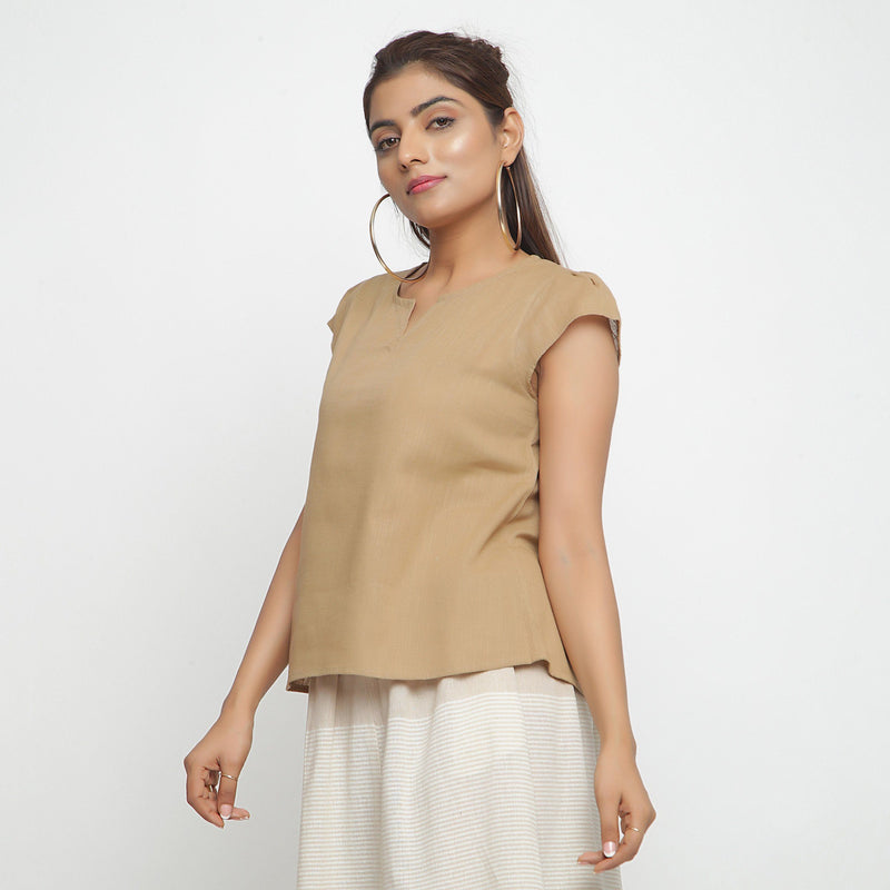 Left View of a Model wearing Beige Puff Sleeves Cotton A-Line Top