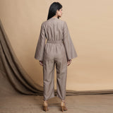 Back View of a Model wearing Beige Flared Sleeve Gathered Jumpsuit