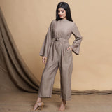 Left View of a Model wearing Beige Flared Sleeve Gathered Jumpsuit