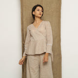 Front View of a Model wearing Beige Handspun Full Sleeve V-Neck Wrap Top