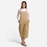 Front View of a Model wearing Beige Pinafore Midi Length Dungaree