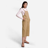 Right View of a Model wearing Beige Pinafore Midi Length Dungaree