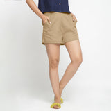 Front View of a Model wearing Beige Solid Cotton Short Shorts