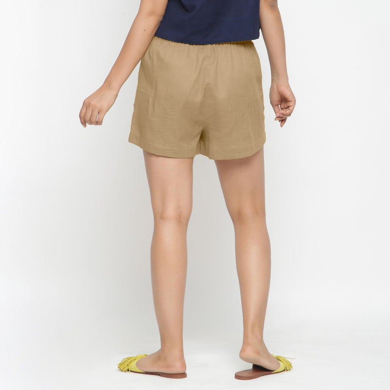 Back View of a Model wearing Beige Solid Cotton Short Shorts
