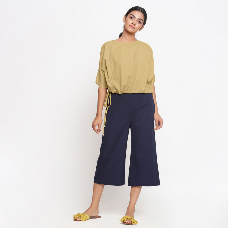 Front View of a Model wearing Light Khaki Top and Navy Blue Culottes Set