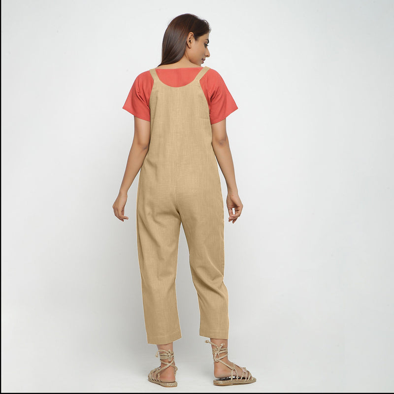Back View of a Model wearing Beige Strap Sleeve Solid Dungaree