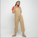 Front View of a Model wearing Beige Strap Sleeve Solid Dungaree