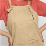 Front Detail of a Model wearing Beige Strap Sleeve Solid Dungaree