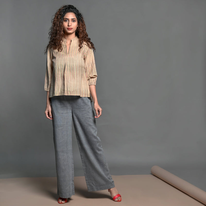 Front View of a Model wearing Beige Striped Handwoven Cotton Split Neck Pleated Shirt