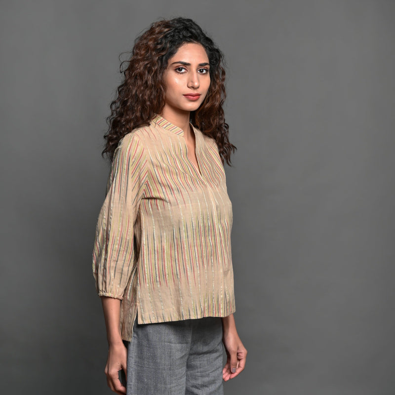 Right View of a Model wearing Beige Striped Handwoven Cotton Split Neck Pleated Shirt