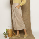 Left View of a Model wearing Beige Handspun Cotton Wide Legged Culotte