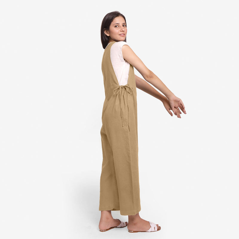 Right View of a Model wearing Beige Waist Tie Up Pinafore Jumpsuit