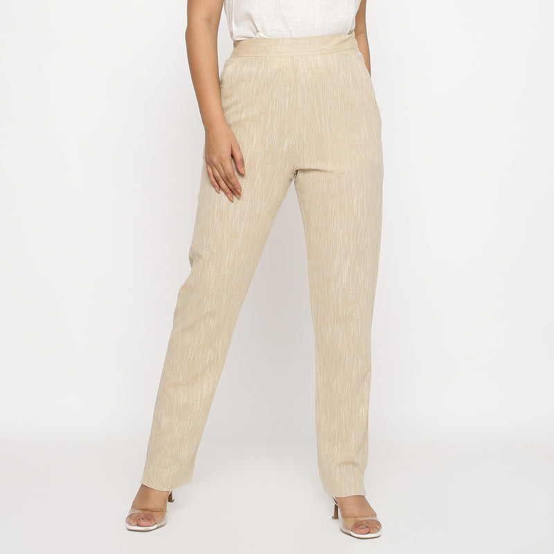 Front View of a Model wearing Beige Yarn Dyed Mid Rise Tapered Pant