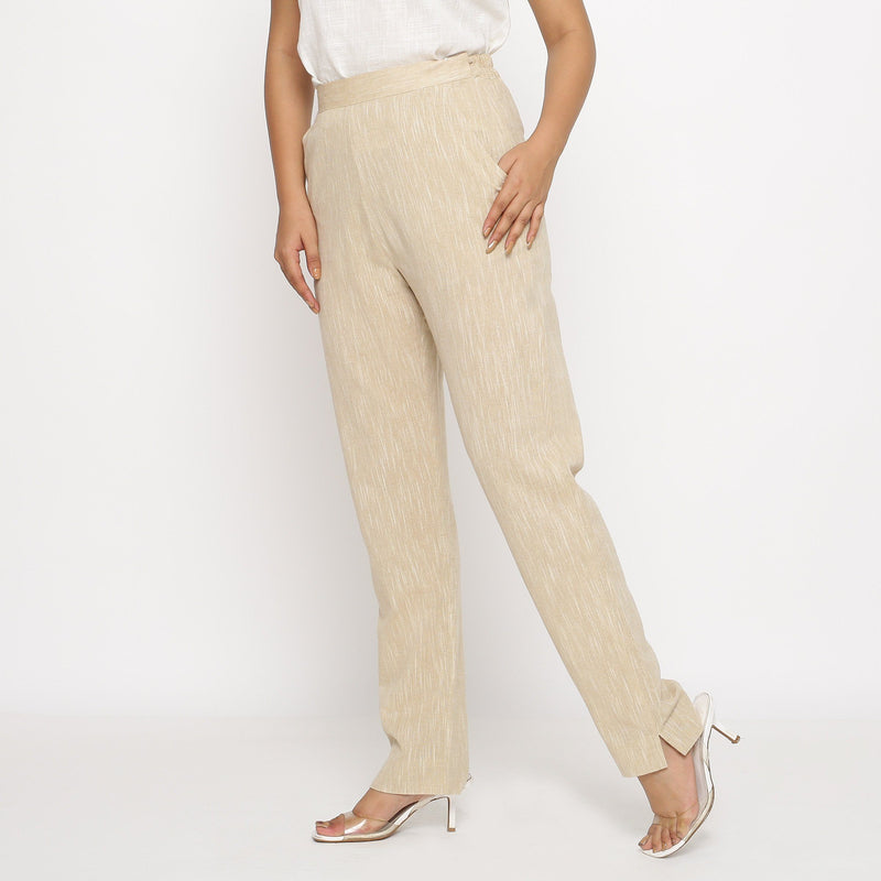 Left View of a Model wearing Beige Yarn Dyed Mid Rise Tapered Pant