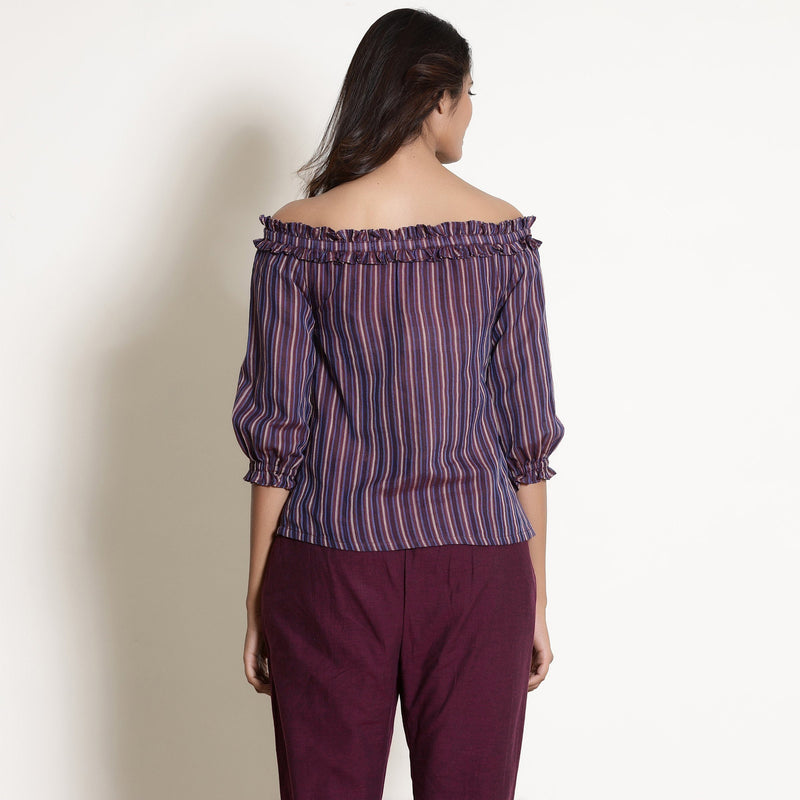 Back View of a Model wearing Berry Wine Striped Off-Shoulder Frilled Top