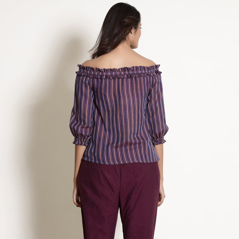 Back View of a Model wearing Berry Wine Striped Cotton Off-Shoulder Frilled Top