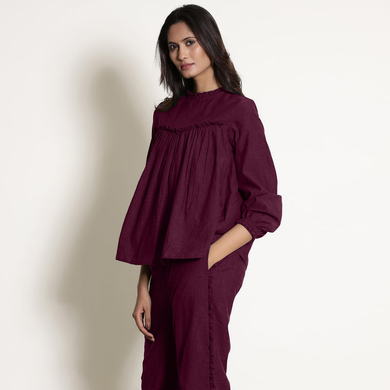 Left View of a Model wearing Warm Berry Wine Frilled Gathered Yoked Top