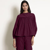 Front View of a Model wearing Warm Berry Wine Frilled Gathered Yoked Top
