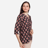 Right View of a Model wearing Black Bagru-Printed Shawl Collar Top